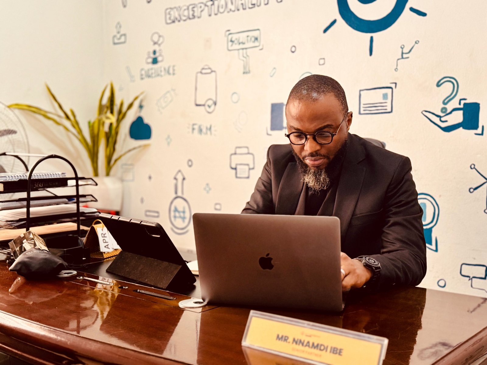 Nnamdi at his desk